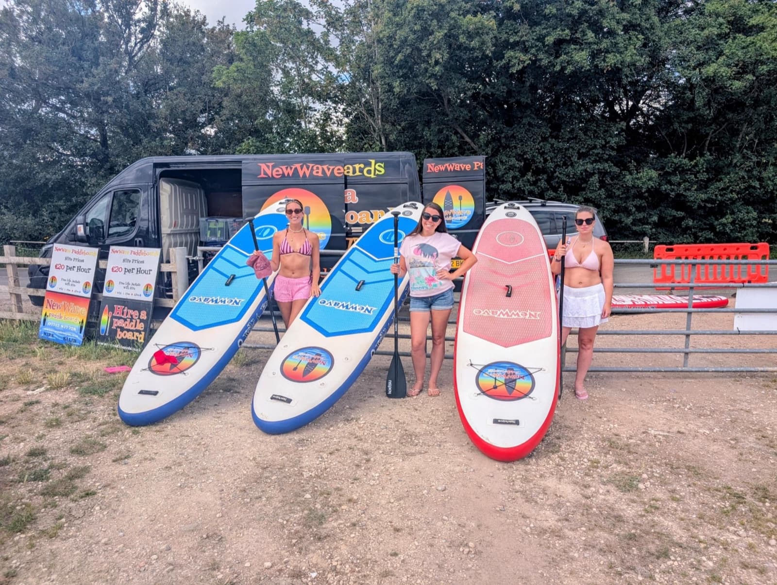 Three NewWave boards lined up by the van at Dedham Meadows